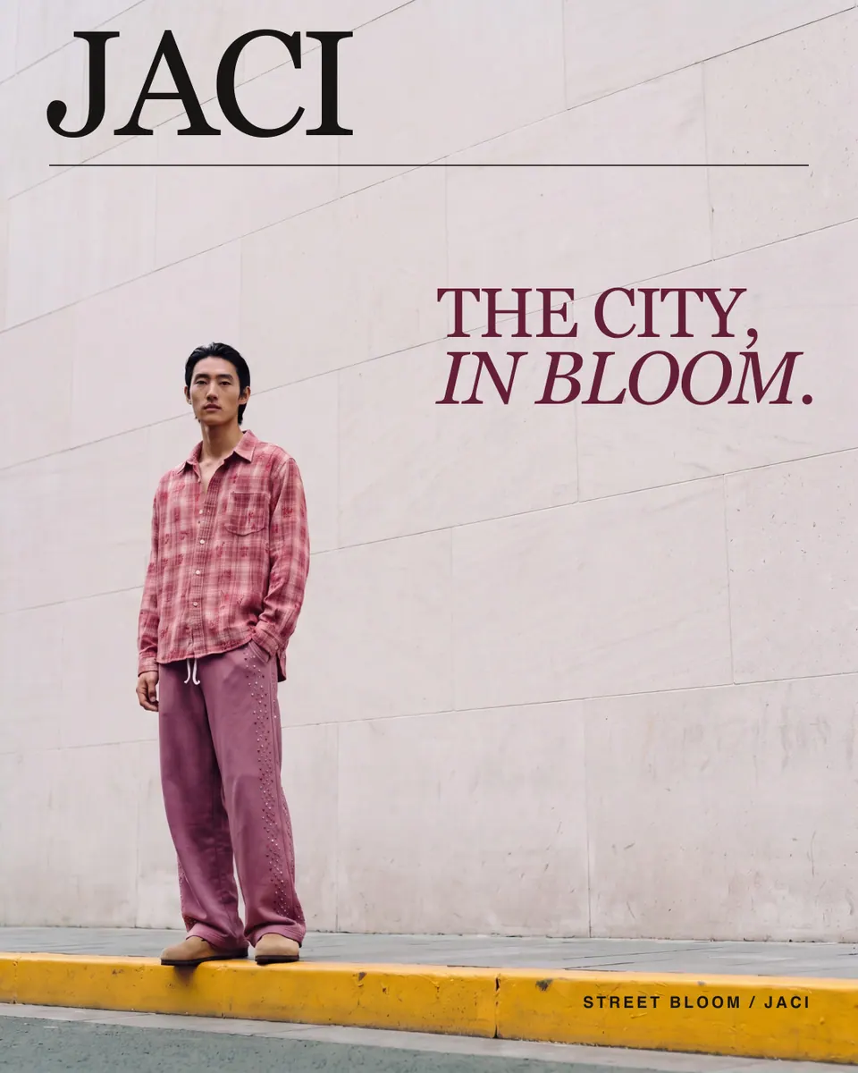 First version of the JACI wall ad: a serif JACI masthead over a thin rule, the line "The city, in bloom." and a small "Street Bloom / JACI" label.