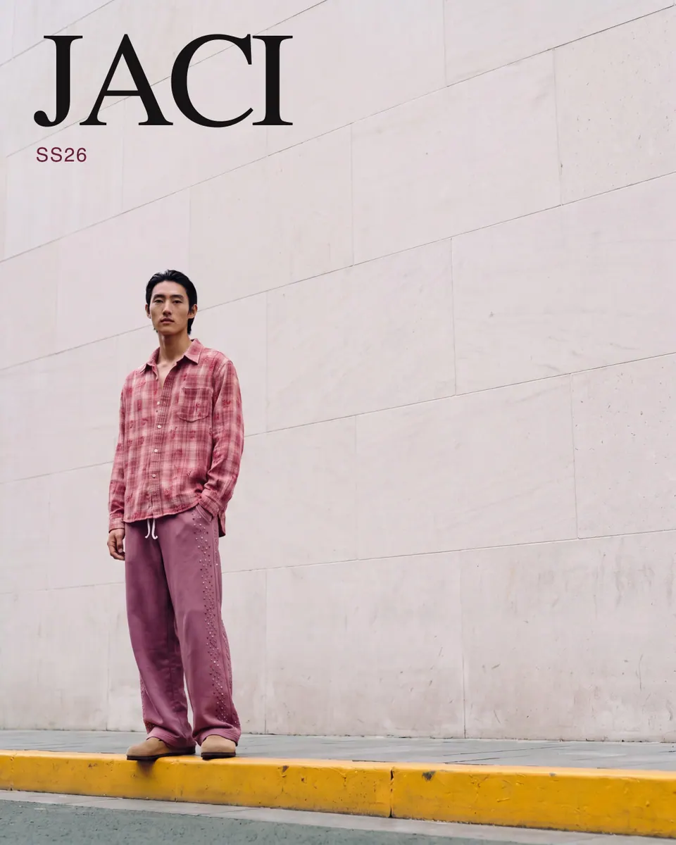JACI SS26 ad: full-bleed frame against a white wall with the JACI wordmark and SS26.