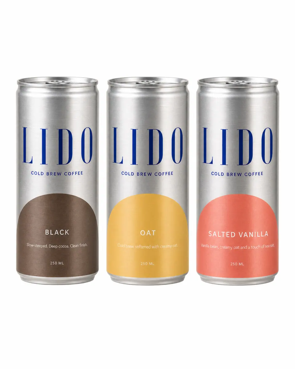 Three silver LIDO cold brew cans, Black, Oat and Salted Vanilla, side by side on white.