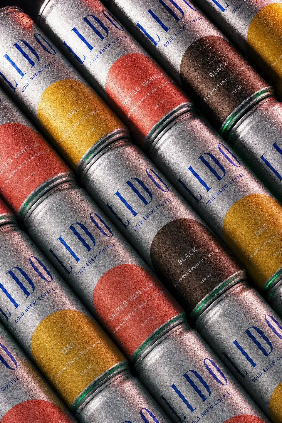 Diagonal rows of LIDO cans in all three flavours filling the frame.