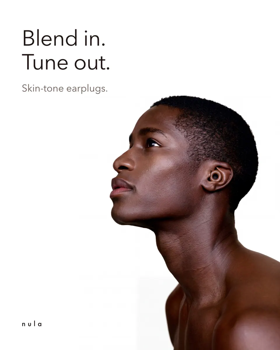 Nula ad: "Blend in. Tune out." beside the profile portrait.