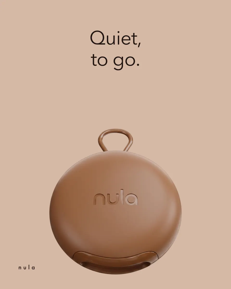 Nula ad: "Quiet, to go." above the case on a tan background.