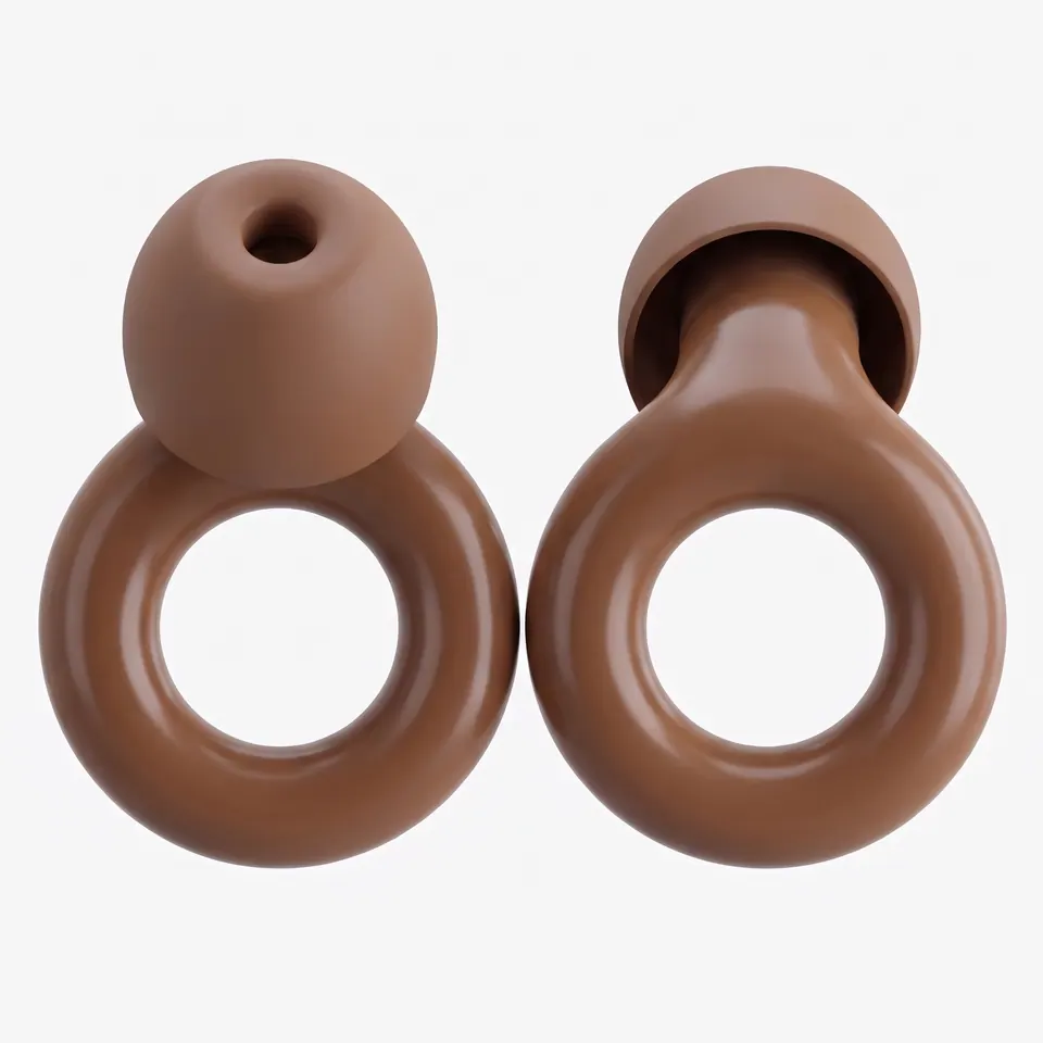 Two brown earplugs upright and face-on, one showing the bore in its tip.