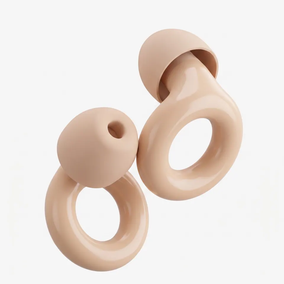 The same pair of earplugs in pale beige.