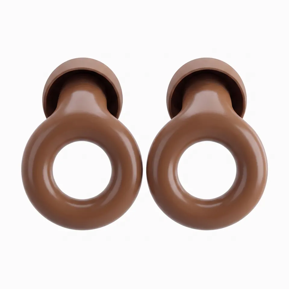 Two brown earplugs turned so their loops face the camera.